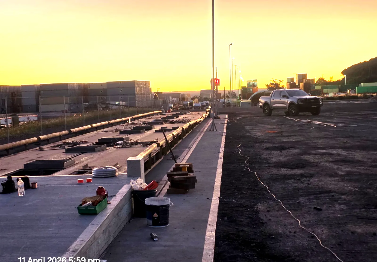 Weighbridge decks positioned on new foundations at dusk during the weekend closure