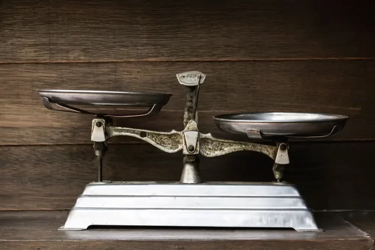 Vintage weighing scale made of stainless steel with a flat base