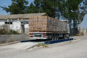 A loaded truck on top of a weighbridge for weighing before transport